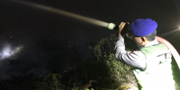 KABUT ASAP MENYIKSA MASYARAKAT KALIMANTAN